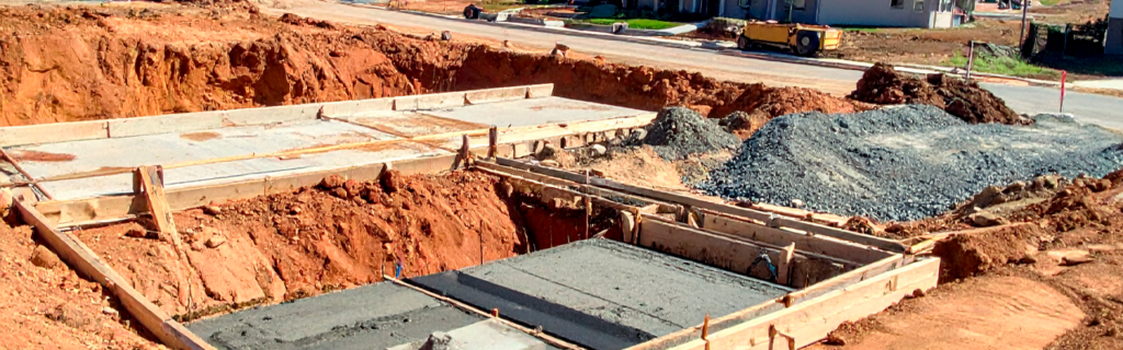 Learn why proper building pad preparation is important for construction projects in North Georgia, including grading, soil compaction, drainage planning, and site stability.