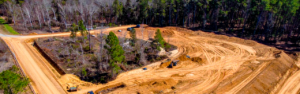 Learn the most important things to consider before clearing a wooded lot, including drainage, access, grading, debris management, and preserving mature trees on North Georgia properties.